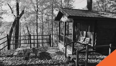 Cottage covered in fallen leaves near the lake