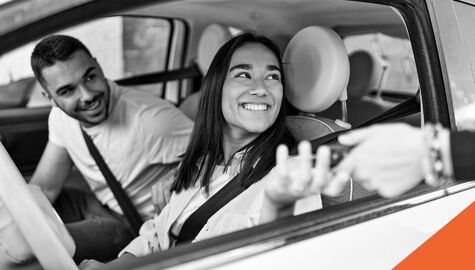 Man and woman buying a new car