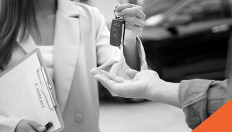 Selling a Used Car in Ontario | Billyard Insurance Group | Man in driver's seat of car smiling