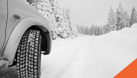 My Car is Stuck in Snow - Now What? | car stuck along snow covered tree lined road | Billyard Insurance Group blog