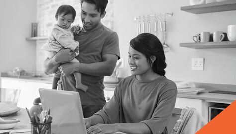 Family completing taxes at table