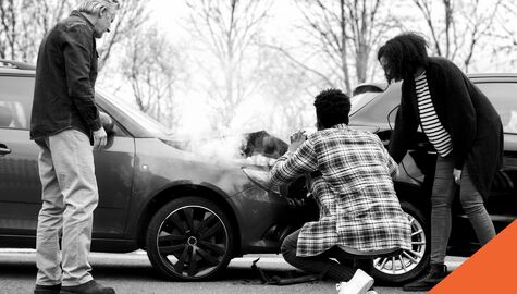 people inspecting car after accident