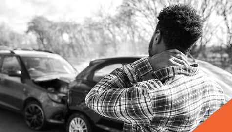 injured man holding neck