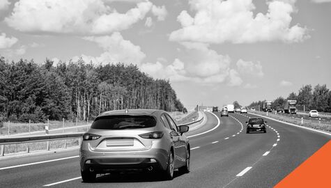 Car driving down road