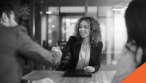 woman shaking hands in a business meeting
