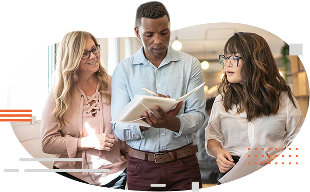 image of person writing notes while colleagues observe